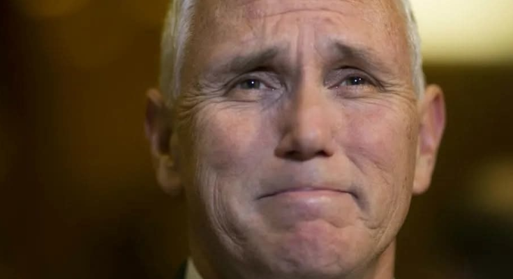 Mike Pence delivering a sad announcement at a podium with an emotional expression