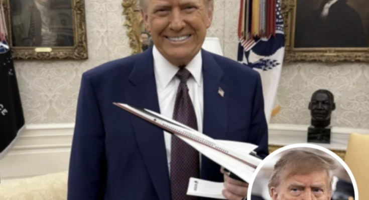 Trump holding supersonic jet model Oval Office
