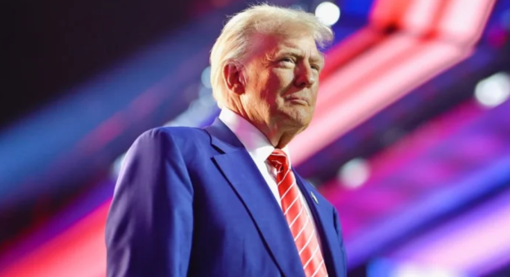 Trump mug shot framed in White House hallway