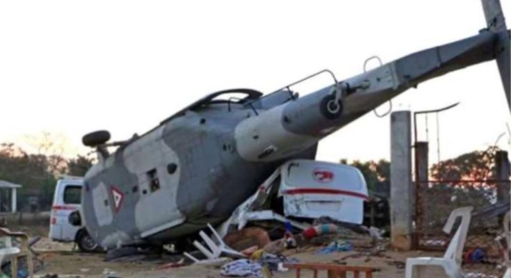 Crashed helicopter crushing vehicles in residential zone