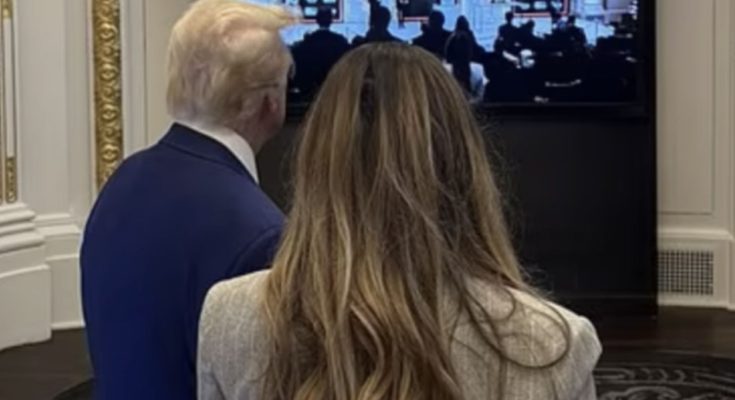 Melania Trump viewed from behind showing hair