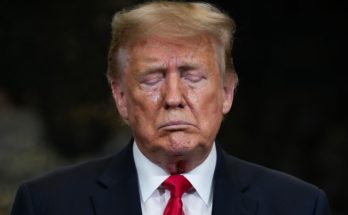 Trump standing silently in Washington