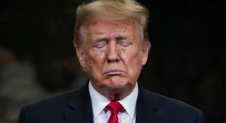 Trump standing silently in Washington