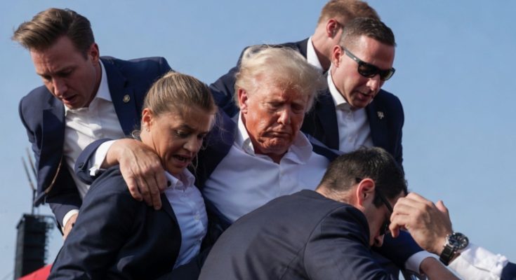 Trump shielded by Secret Service agents