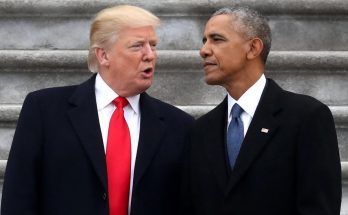 barack Obama speaking at podium, Donald Trump arms crossed, both men standing on stone