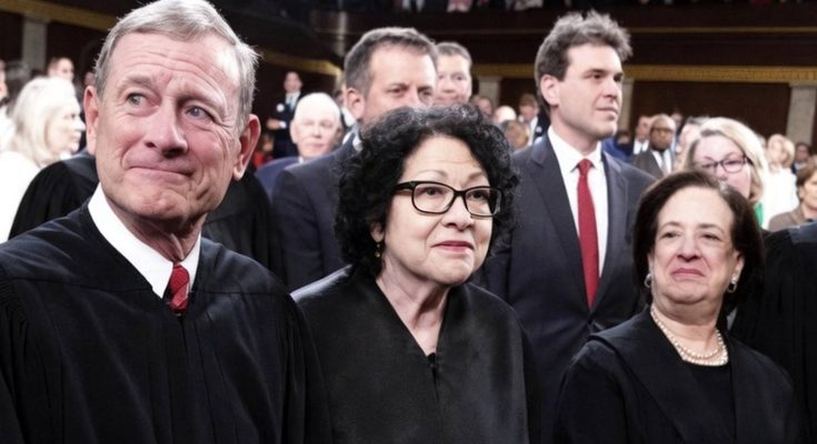 supreme Court justices in black robes stand solemnly in a courtroom with text overlay