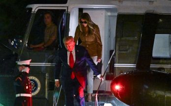 donald Trump and Melania Trump disembark Marine One at night, Marine salutes