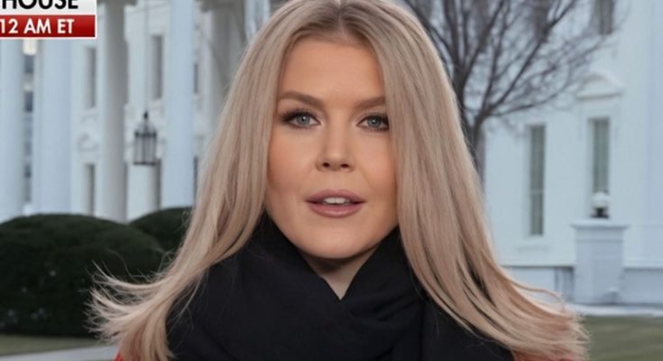 blonde woman in red coat and black scarf stands before White House columns with BREAKING