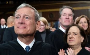 supreme Court justices in black robes applauding with bold headline text reading